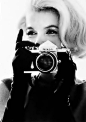Marilyn Monroe with a Nikon F by Bert Stern