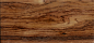 虎斑木（南美黄花梨）参考纹理2
木材名称：虎斑木
产地： 巴西
规范名称：虎斑木
别名： 南美黄花梨  
类别：深色名贵硬木
科属：龙舌兰科虎斑木属 
拉丁名：Astronium sp.
颜色：金褐色  
纹理：纹理交错，纹理清晰，呈虎斑纹  
气味： 松脂香味
气干密度：1.0-1.1g/cm³
油脂含量：中  
2014年市场原材料情况: 口径约20cm-40cm
连天红家具平均出材率:23%-28%
优点：
①虎斑木的条纹宽窄不等，呈深褐色至黑色，纹理清晰，成虎斑纹。
②木材稳定性佳，心边材区别明显