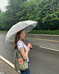 Photo by @rovorin on May 04, 2024. May be an image of 1 person, umbrella and parasol.