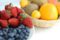 Red Strawberry, Blue Berry on White Plate Near Brown Woven Basket