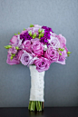 bouquet was filled with purple opulence -- roses, hydrangeas, and berries