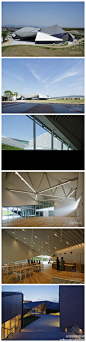 隈研吾设计的日本折叠艺术博物馆。设计师为博物馆设计一个引人注目的折纸般的屋顶，并且赋予它倾斜的样式，使它远远看上去就像群山一样，这座醒目的博物馆仿照河流的流动形态和山地景观，并且运用不同的材质和纹理，还运用了绿色的太阳能电池板作为墙壁。【详见】http://t.cn/zRxnltk