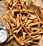 Gwyneth Paltrow's No-Fry Fries, just cut up your potatoes and place them in a bowl of cold water, then dry them off and toss them with olive oil, place them on a cookie sheet and sprinkle with sea salt, then bake at 450 for about 25 minutes, turning occas