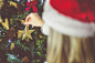 Young Woman Decorating a Christmas Tree Free Image Download