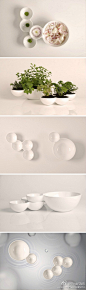 西班牙女设计师Veronica Martínez设计的陶瓷容器，灵感来自夏天的雨滴，包括四只和两只相连的瓷碗，彼此可以灵活地嵌套，形成雕塑般的优美外形。功能多样，可用来盛放食材或栽培花草。