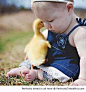 Baby and her duckling friend | Perfectly Timed Pics