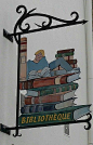 Sign for the Library of La-Roche-Bernard. La-Roche-Bernard is a town in the Brittany Region in north-western France.: 