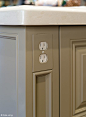 Integrated power outlets in kitchen island. Functionally smart! I love the matching plate too.