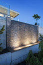 ALKA POOL - This impressive water wall acts as a water feature bringing an added elegance to the home with the added benefit of noise cancelling the nearby traffic.  www.alkapool.com: 