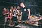 Group of friends making barbecue in the backyard at dinner time by Cristian Negroni on 500px