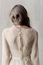 Olive long sleeves lace wedding dress with a corset / http://www.deerpearlflowers.com/unique-sophisticated-wedding-dresses-from-cathy-telle/: 