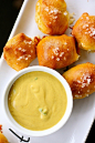 For the pretzel bites:

1  and 1/2 teaspoons active dry yeast

2 tablespoons plus 1 teaspoon packed light brown sugar, divided

1/4 cup warm water (110-115°F)

1 cup warm milk (110-115°F)

2 and 1/2 to 3 cups all-purpose flour

1/3 cup sharp white Cheddar