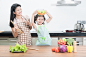 Asian mother and kid daughter cooking in kitchen by Prasit Rodphan on 500px