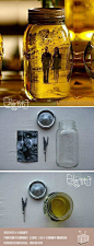 创意DIY?在装满橄榄油的玻璃罐内放入一张自己喜欢的黑白照片，就可以制作出一个独特的怀旧“相框”~