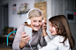 A small girl and grandmother with smartphone at home. by Jozef Polc on 500px