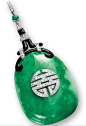 JADEITE, DIAMOND, ENAMEL AND ONYX PENDANT, CIRCA 1925, BOUCHERON    Of Art Deco design, the translucent jadeite plaque of emerald green colour suffused with white patches; decorated with a Chinese calligraphy shou (壽) set with brilliant-cut diamonds, symb