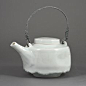 EDMUND DE WAAL (British, b.1964) AR Teapot, 1995 Porcelain, pale blue celadon glaze with a delicate crackle, mounted with a twisted looping g silver metal handle, impressed maker's mark