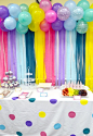 easy and colorful decor...balloons and streamers backdrop