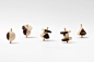 craft combine creates a spinning top influenced by korean characters : design firm craft combine has created a set of spinning tops influenced by hangeul characters, made out of two types of hardwood.