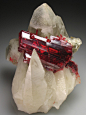 libutron:

Realgar in Calcite | ©Crystal Classics
Jiepaiyu Mine (Shimen Mine), China.
