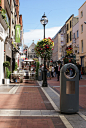 http://www.hartecast.co.uk/street-furniture/ A good example of the right blend of traditional and contemporary design seen in this beautiful image of a busy town promenade. Visit our site for more modern litter bin designs.