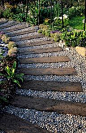 Railroad timbers and pea gravel for the west side of the house.