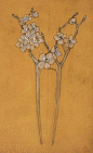 Lalique: drawing of a comb with flowers on a tree branch.