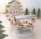 Nespresso Holiday Joy : For Nespresso's latest Holiday campaign, we designed and created a miniature fairground, complete with a coffee capsule ferris wheel, coffee cup carousel and an intricate machine maze. After we designed and built almost all of the 
