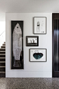 Dark ink works and sketches by Heather B. Swann installed at the Winter Street Residence by B.E Architecture