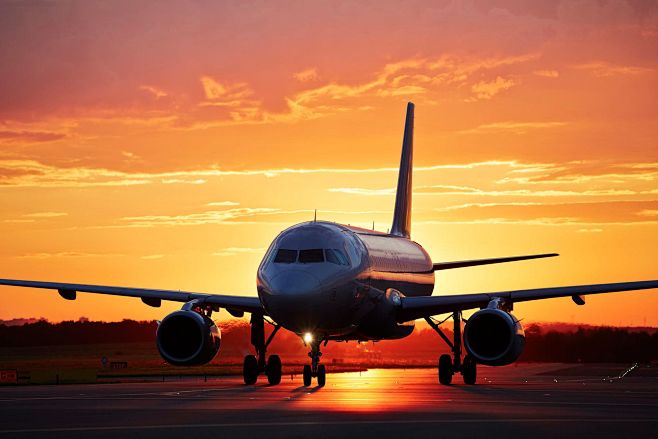 Landing at sunset by...