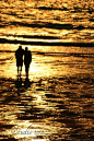 a couple at sunset
