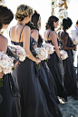 Grey Bridesmaid Dresses--Bridesmaids were dressed in dark grey, floor-length dresses and carried bouquets composed of pink and cream flowers. They wore their hair in braids or down in loose curls. 