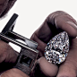 A Master craftsman looking at the Graff Vendome diamond through a loupe