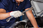 Mechanic Holding Wrench While Examining Car Engine - Originoo锐景创意 图片详情
