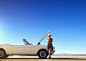 Caucasian woman stranded with broken down convertible on remote road by Gable Denims on 500px