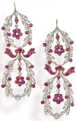 A pair diamond and ruby pendant earrings,  each designed as a double wreath of rose and old European-cut diamonds accentuated by circular-cut rubies in a floral motif; mounted in platinum and eighteen karat gold; length: 2 3/8in. Via Bonhams. Via diamonds