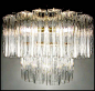 A spectacular 1960's Murano chandelier by Venini. Two tiers of textured glass (referred to as tronchi) provide the ultimate in vintage glam lighting. Image © Eclectisaurus. Visit our shop at 249 Gerrard St E, Toronto. 416-934-9009 www.eclectisaurus.com: 