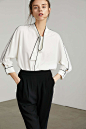 Chic white blouse with necktie and contrast stitch piping by J.ING