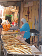 ~Woman selling bread in Akko, Israel