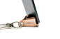 KEYRING : 
The classic leather key ring with a smart and subtle cut offering smartphone docking capability. Very convenient as a travel accessory for video calls or watching movies.
Produced in recycled, bonded leather.
Made in Belgium.
 
Download  PDF