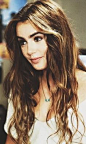 Lily Collins: brown hair + caramel highlights. Thick brows + dark eyes.