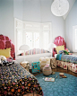 Matching twin beds in an eclectic room