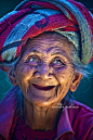 An old Balinese woman with a joyous face.