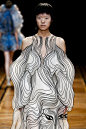 iris van herpen uses laser cutting techniques to create 3D anamorphic couture