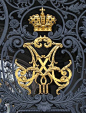 Royal crest or not, this looks like a monogrammed "M". Make a mental note - for your front gate at some point.: 