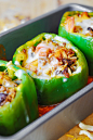 Stuffed bell peppers with ground beef black beans tomatoes and rice and cheese