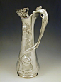 yama-bato: Polished pewter flagon with a handle in the form of a figural art nouveau mermaid,  Germany Date c.1906