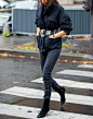 woman wearing skinny jeans and black boots