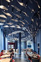 Love the idea of this "school of fish" shimmering from the dining hall ceiling.