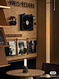 This may contain: a record player is on the wall next to a table